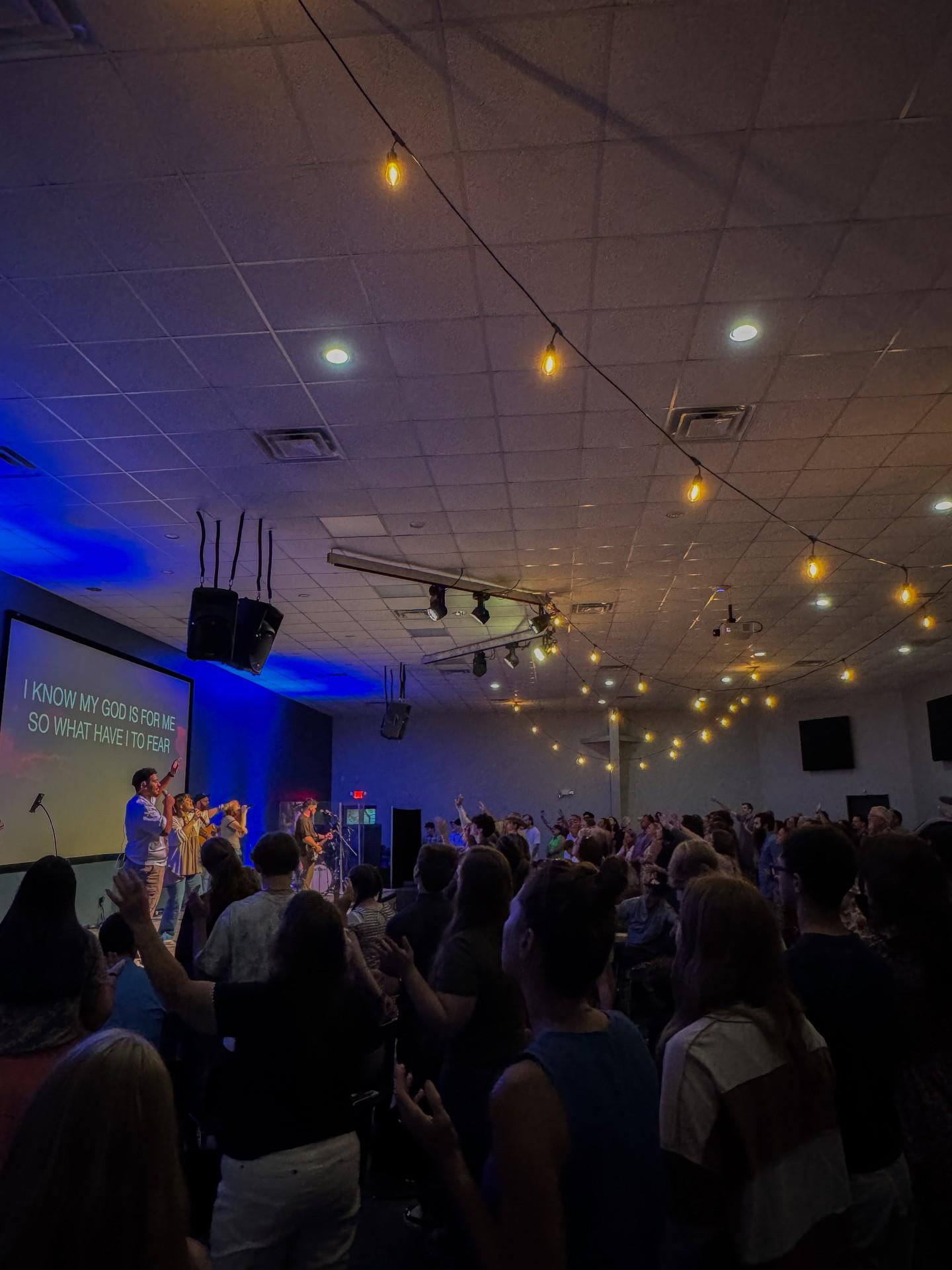 The Good News Co. community worshipping together on Sunday.